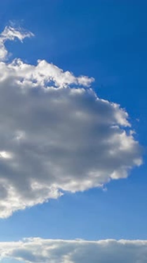 Wonderful light clouds against beaming sun. Cloudscape formation timelapse on fantastic summer day