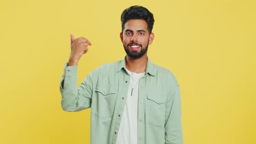 Friendly Young Adult Smiling and Waving Hello