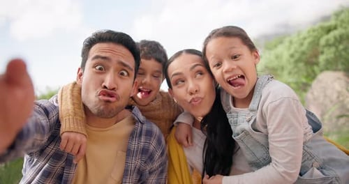 Happy Family Taking Selfie in a Natural Setting