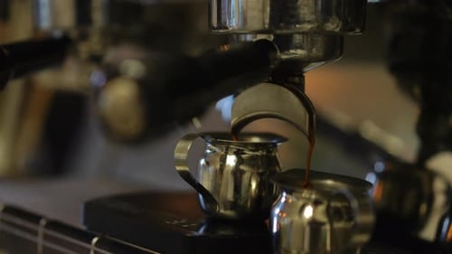 Espresso Machine Pouring Rich Coffee into Cup