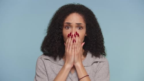 Woman Looks Worried in Close Up Portrait