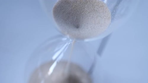 Sand Flowing in an Hourglass Timer, Close Up