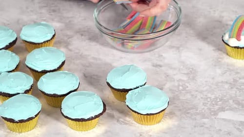 Decorating Chocolate Cupcakes with Buttercream Frosting and Rainbow Candy