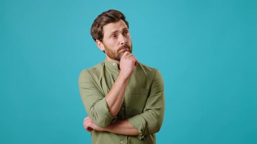 Man Thinking and Smiling in Studio Setting