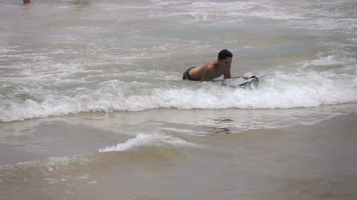 Teenage Boy Surfing on Board in Sea, Super 240