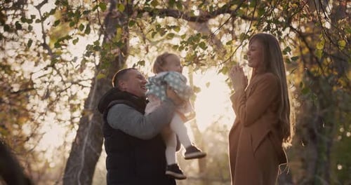 Happy Family with Child Have Fun in Autumn Park