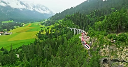 Railway Scenic Route in Switzerland Express Red Swiss Train in Swiss Alps Landwasser Viaduct World