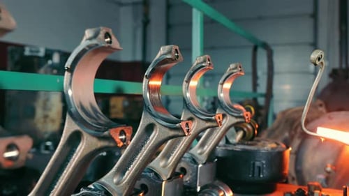 Close Up of Connecting Rods in Factory