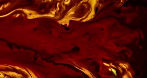 Abstract Swirling Red and Yellow Paint Motion