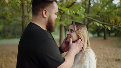 Romantic Couple Sharing a Tender Moment in Autumn Park