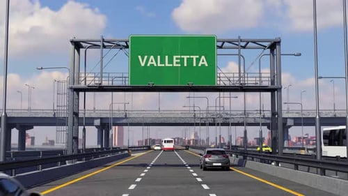 Flying High Over Valletta Road And Aeroplane Passing Above The City Sign Board