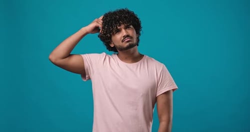 Man Puzzled with Confused Look and Open Arms