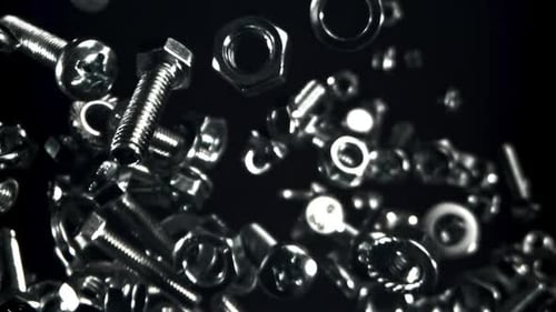 A Variety of Fasteners Fly Up and Down Filmed on a Highspeed Camera at 1000 Fps