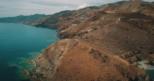 Aerial shot of the south coast of Crete with turquoise waters and beautiful scenery.