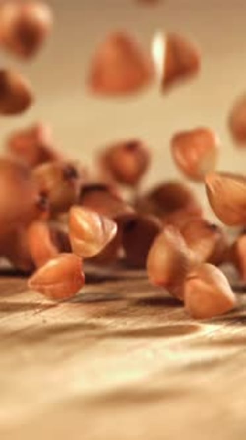 Buckwheat Falls on a Wooden Table Filmed on a Highspeed Camera at 1000 Fps