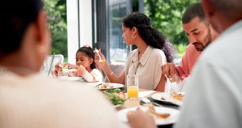 Family Eating Meal Together Outdoors in Daytime