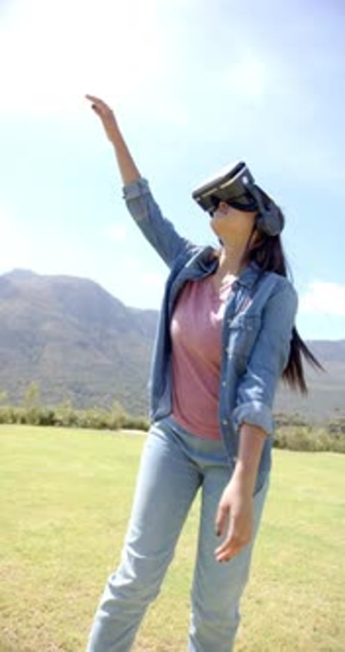 Woman Experiencing Virtual Reality in Green Park