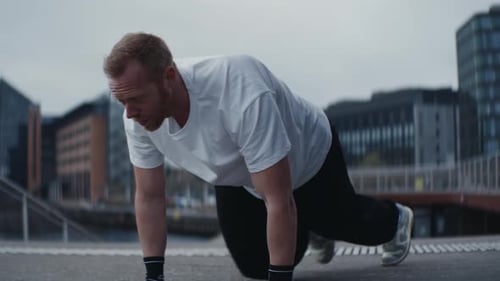 Man Doing Mountain Climbers Exercise Outdoors