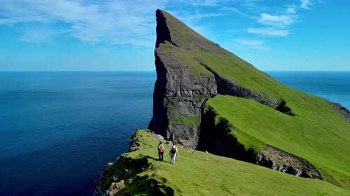 Explore Stunning Cliffs of Faroe Islands with Breathtaking Ocean Views and Vibrant Greenery