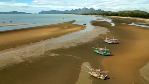 Aerial view of boats on beach, Thailand.