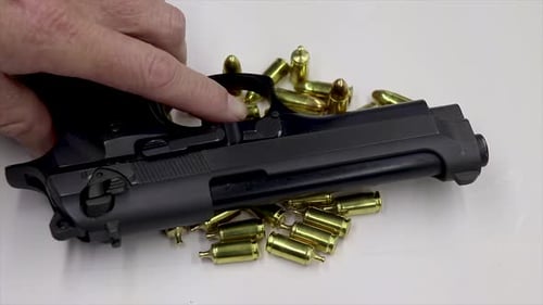 Handgun and Bullets Close Up