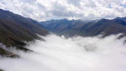 Aerial Flying Over Cloudy Valley