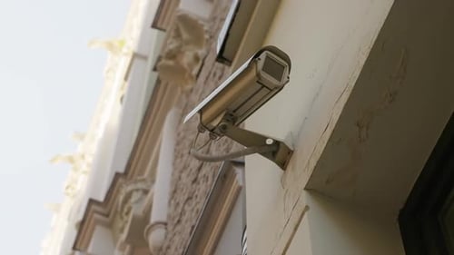 Daytime Surveillance CCTV Security Camera Monitors Building Wall Activity