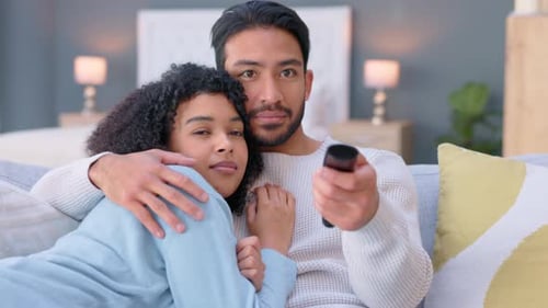 Young couple watching tv, media and movies, cable show and broadcast in home lounge