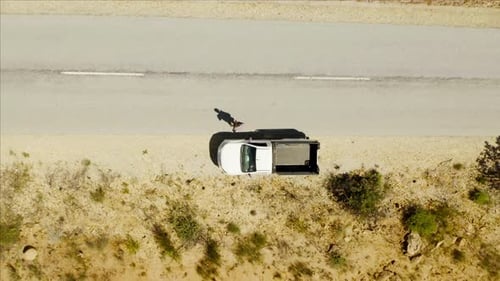 Aerial View of Truck Stopped on Desert Road