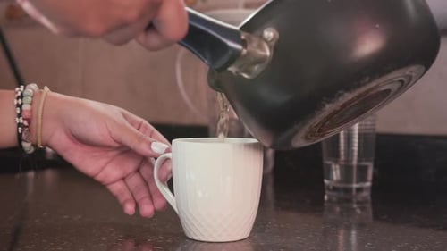 Liquid Being Poured into Mug in Home Kitchen