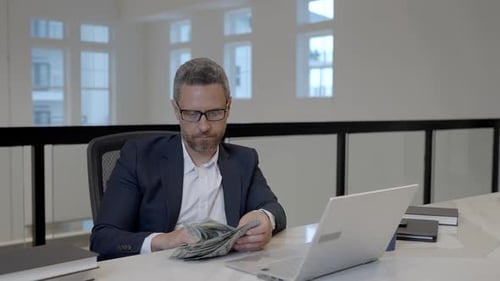 Easy Money Businessman Counting Dollars in Office Rich Man in Suit with Dollars Office Employer Man