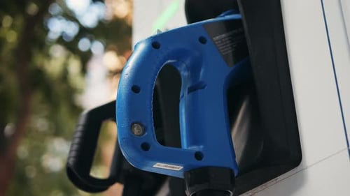 A Modern Electric Vehicle Charging Station Strategically Located in an Urban Setting for Convenience