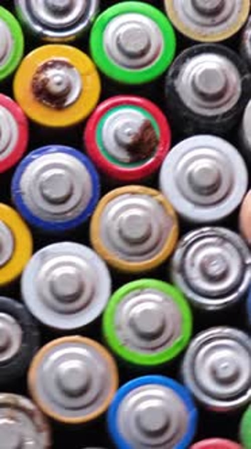 Closeup of Used AA Batteries Finger Batteries Rotate in a Circle Harmful Effects of Batteries