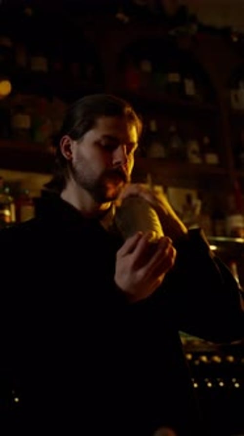Bartender with Shaker Preparing Cocktail