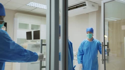 Medical Professionals Consulting in Operating Room