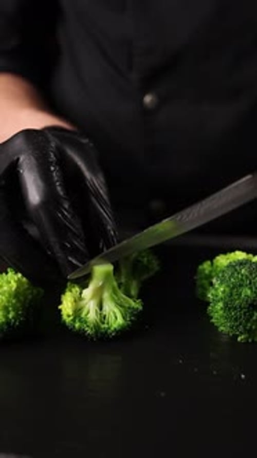 The chef prepares a vegetable dish. Cooking broccoli