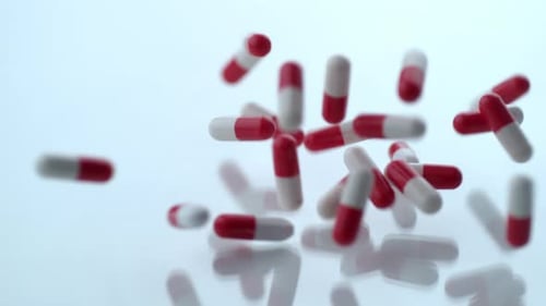 Pills Fall in Slow Motion on Glass