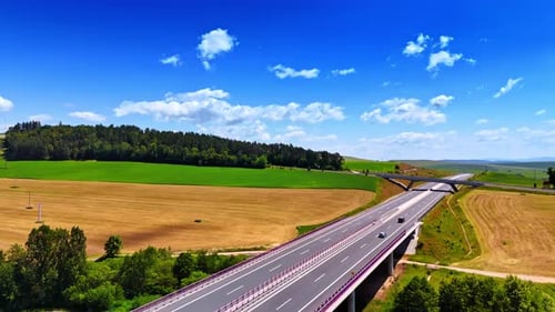 Modern highway and freeway cross the beautiful nature landscape.