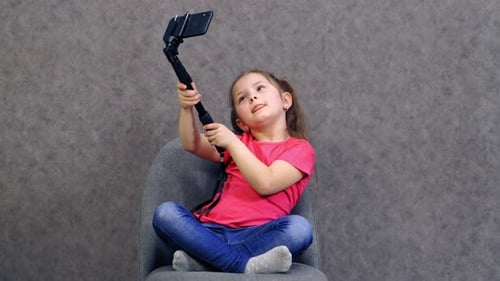 Girl Taking a Selfie with her Phone