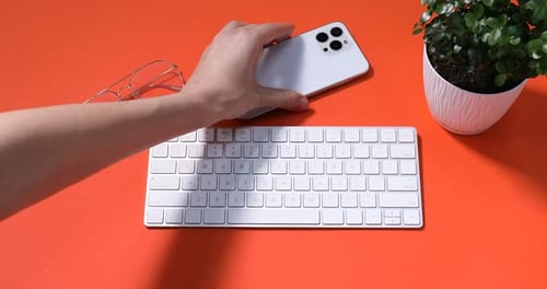 Top view of keyboard and wireless phone