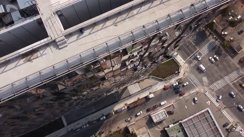 Aerial top down showing group of industrial window washer cleaning skyscraper building