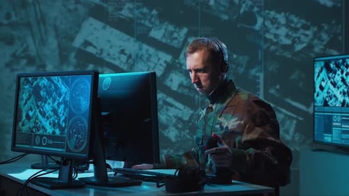 Military Soldier Operating Advanced Technology in a Command Center