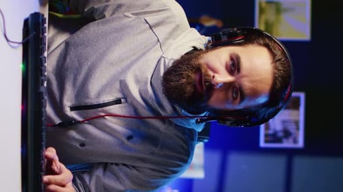 Man Playing Video Game with Headphones