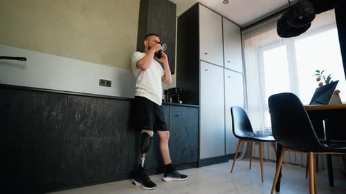 Man With Prosthetic Leg Talking on Phone