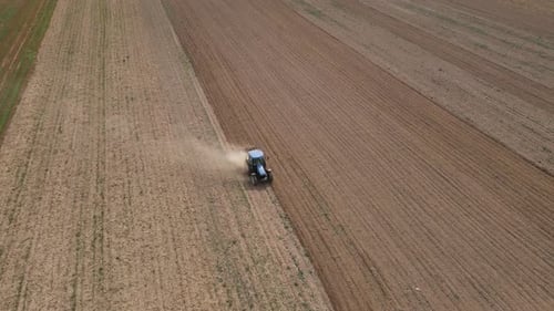 Agricultural Work with Tractor Preparing Field for Harvesting