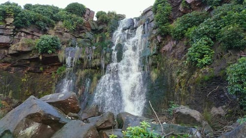 Aerial drone footage of a tall rocky waterfall in the Yorkshire Dales, Pennies. Moorland scene of a