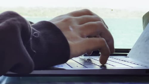 Hands Typing on Laptop Keyboard, Close Up