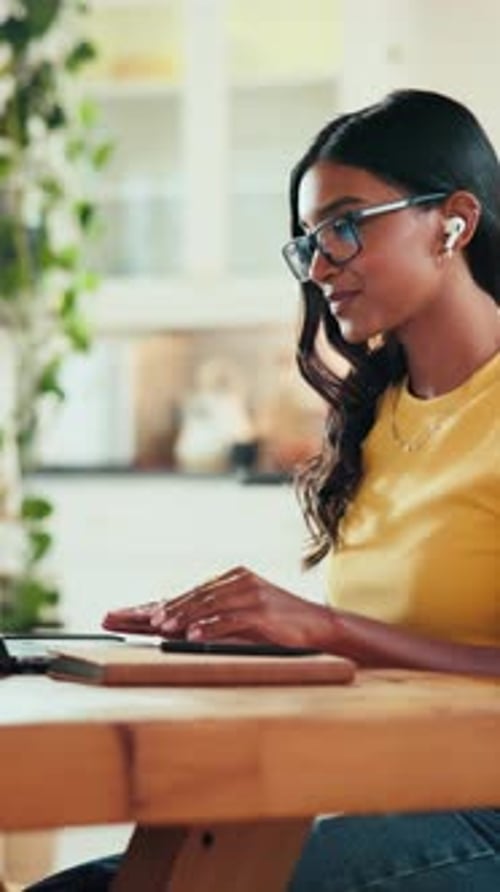 Woman Chatting Online at Home Using Laptop