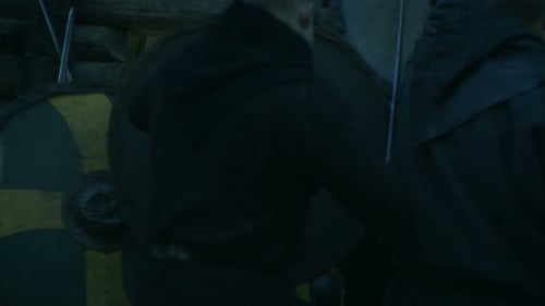 Large-Scale Medieval Battle Reenactment. Violent Tribe of Warriors Run Through The Gates of the Woo