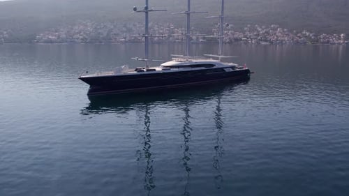Aerial view of exclusive mega yacht anchored in Kotor Bay, Montenegro.